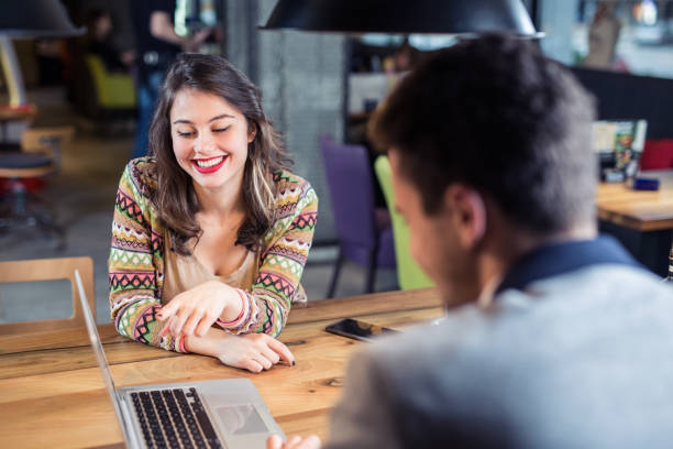 istock Two young businessman having a  meeting at cafe 923518888