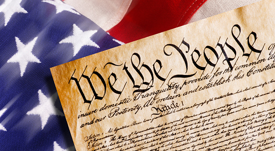 Constitution of America, We the People with American flag.