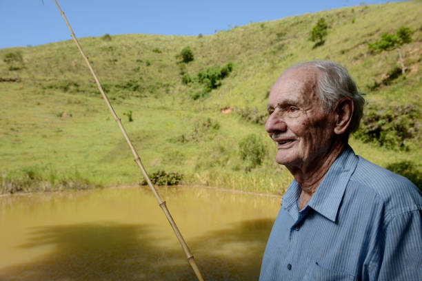 istock 80 years old farmer fishing 923519328