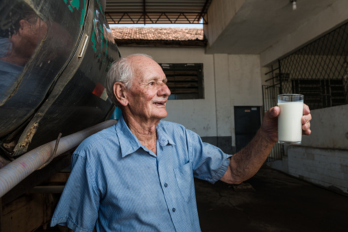 Portrait of a Brazilian elderly in a milk cooperative.