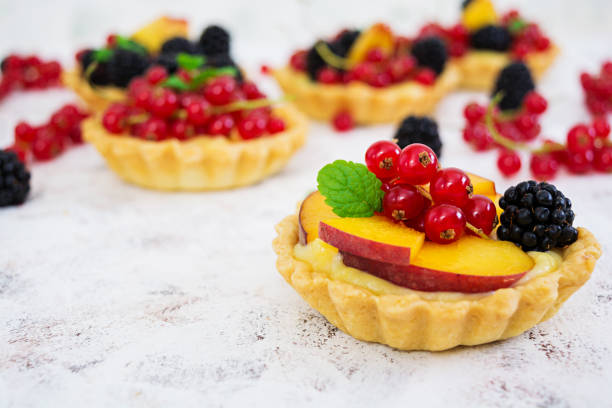 istock Tartlets with different berries on white background 923519750