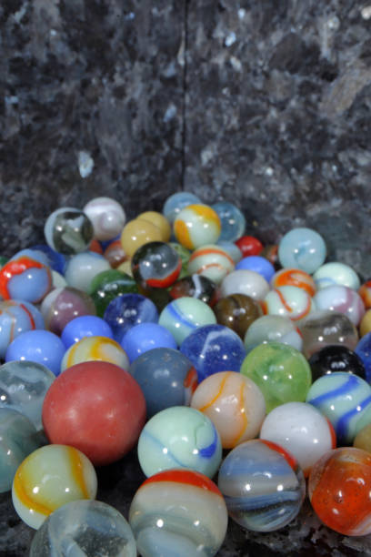 istock toy marbles on blue-grey granite tiles 923519884