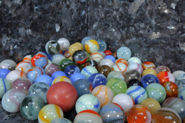 istock toy marbles on blue-grey granite tiles 923519906