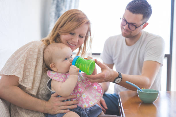 istock Two Caucasian parents play and spend time with their baby 923530704