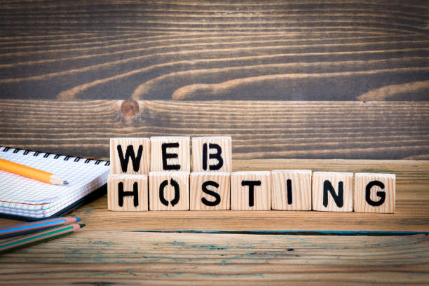 istock web hosting. Wooden letters on the office desk, informative and communication background 923536462