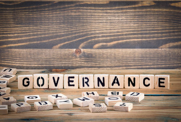istock governance. Wooden letters on the office desk, informative and communication background 923536464