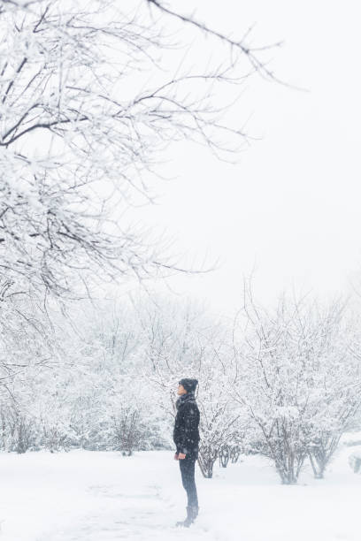 istock young man standing in the snow 923543086