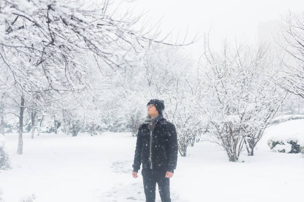 istock young man standing in the snow 923543106