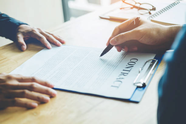 istock Business people negotiating a contract between two colleagues 923543124