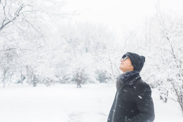 istock young man standing in the snow 923543938