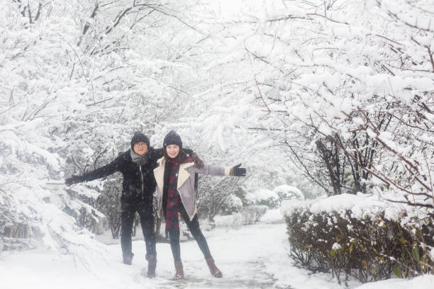 istock affectionate couple standing in winter landscape 923546140