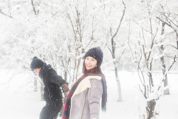 istock affectionate couple standing in winter landscape 923546186