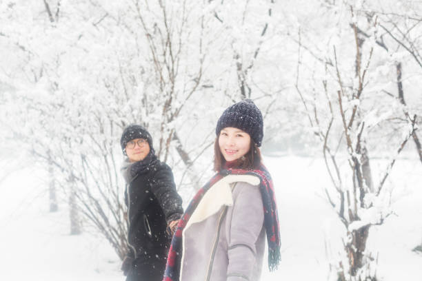 istock affectionate couple standing in winter landscape 923546190