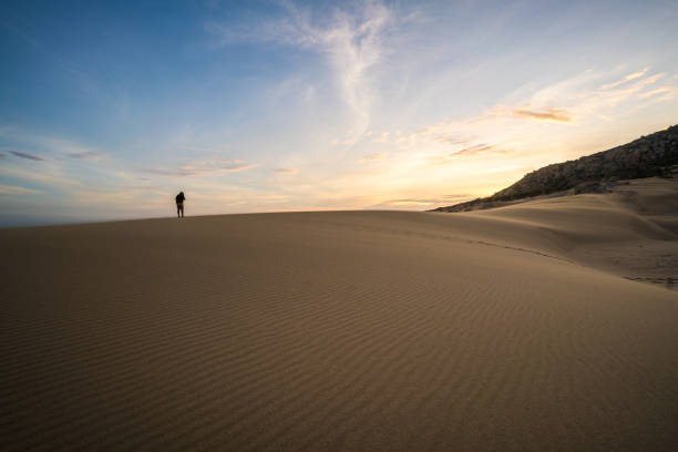 istock Sunrise over the sand dunes 923552358