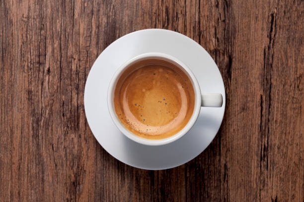 istock top view a cup of espresso coffee on wooden table background 923559120