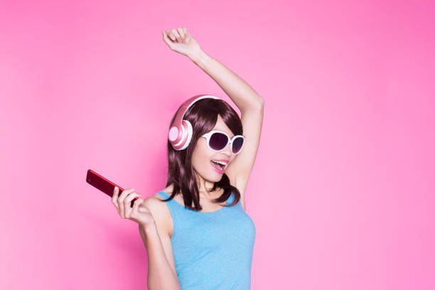 istock woman use phone listen music 923568808