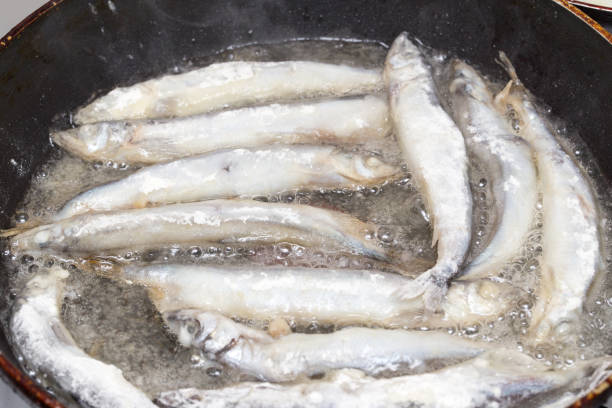 istock capelin in the flour fried in a pan 923573674
