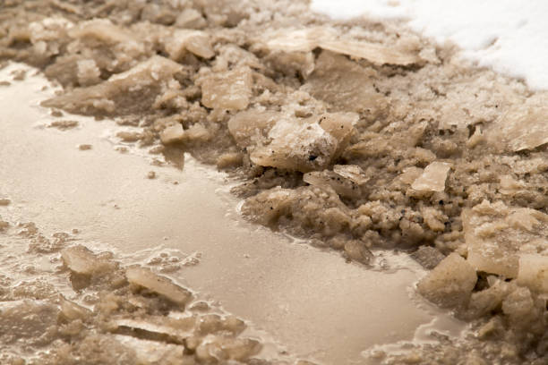 istock winter ice on the ground as a background 923573974