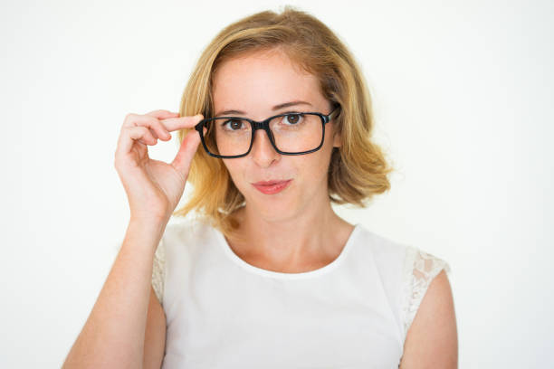 istock Serious Pretty Young Woman Adjusting Glasses 923578418
