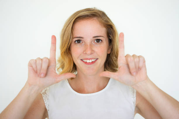 istock Smiling Cute Woman Making Frame Gesture 923578446