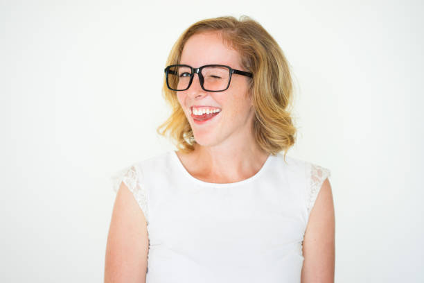 istock Smiling Careless Cute Young Woman Winking 923578470