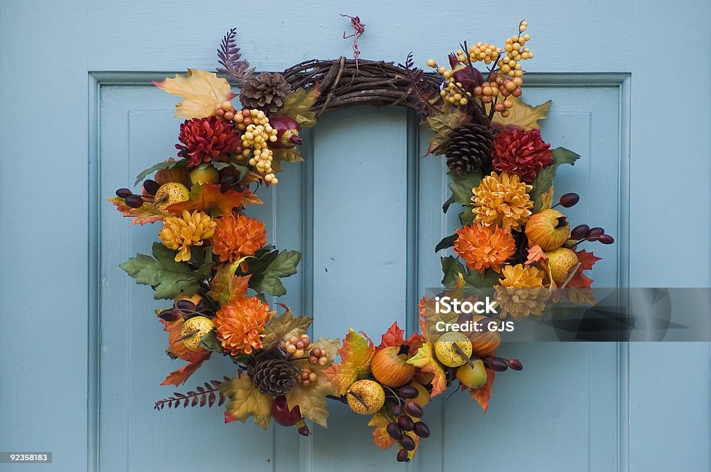 Thanksgiving wreath on a blue door Thanksgiving wreath hanging on residential door Autumn Stock Photo