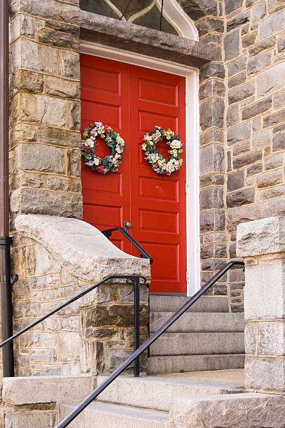 Red Church Door with Holiday Decoration stock photo