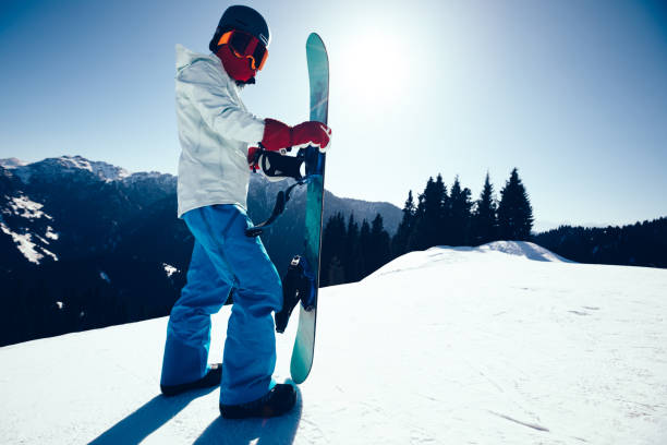 istock one snowboarder with snowboard on winter mountain top 923581982