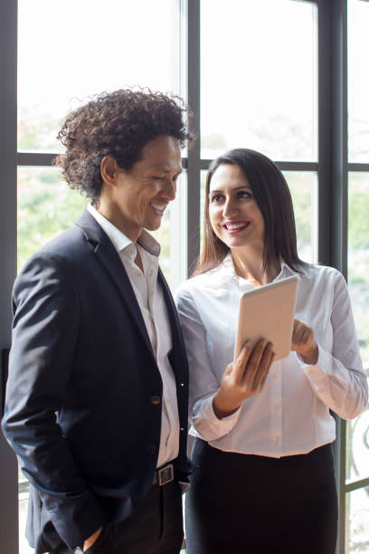 istock Financial analyst showing report to coworker 923582106