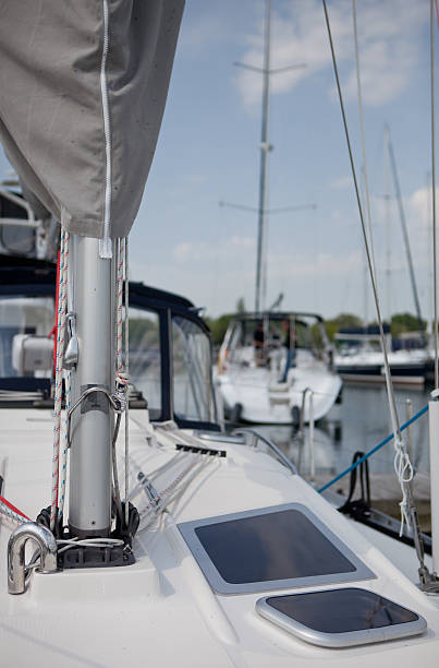 Harbor of a dutch village with sailing yachts moored to a pier