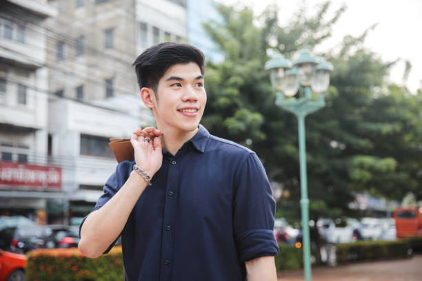 istock Young Asian Man going out for shopping 923584538