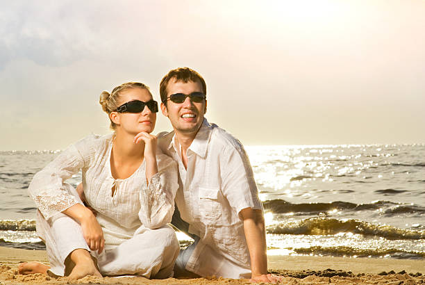 istock Young beautiful couple relaxing on the beach 92358664