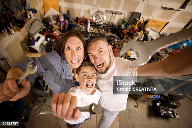 Crazy Doityourself Family With Wrenches Stock Photo - Download Image Now - Family, Mechanic, Mother