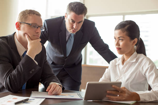 istock Business Team Reviewing Statistics with Tablet 923588262