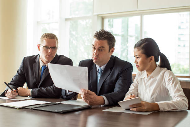 istock Three Business People Meeting at Conference Hall 923588304