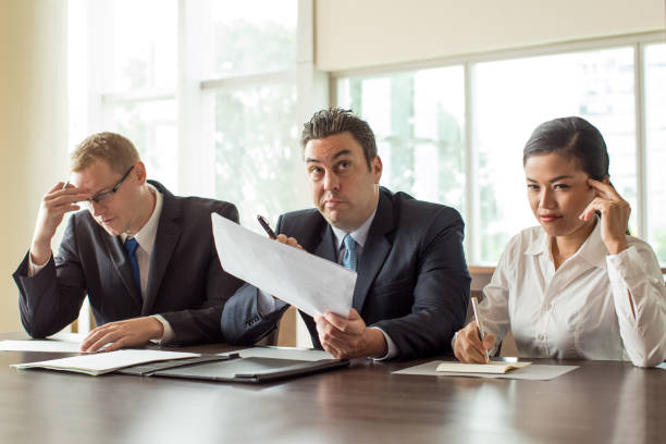 istock Three Pensive Business People during Brainstorming 923588316