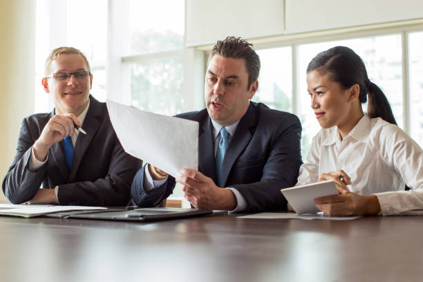 istock Three Company Leaders Discussing Business Plan 923588320