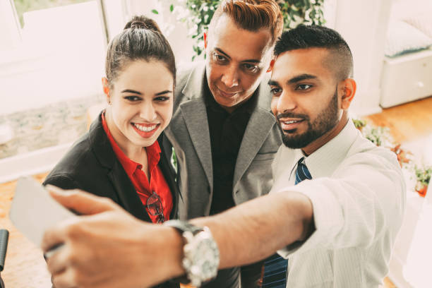 istock Positive business friends taking self-portrait 923590126