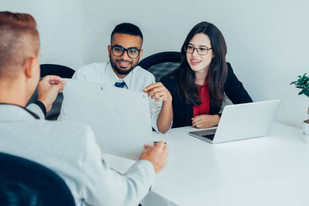 istock Satisfied designer showing sketch to colleagues 923590144