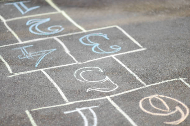 istock Chalk-painted hopscotch on asphalt 923592618
