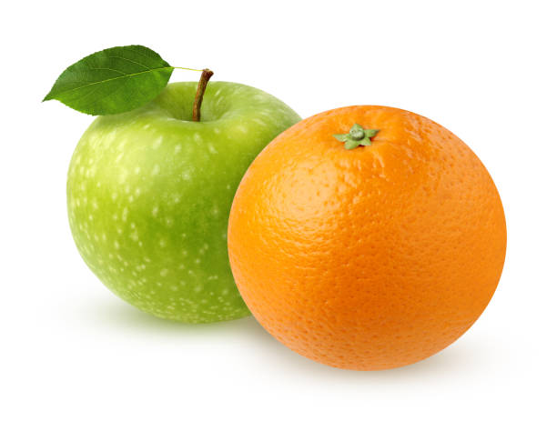 istock Green Apple with leaf and orange, isolated on white 923592658