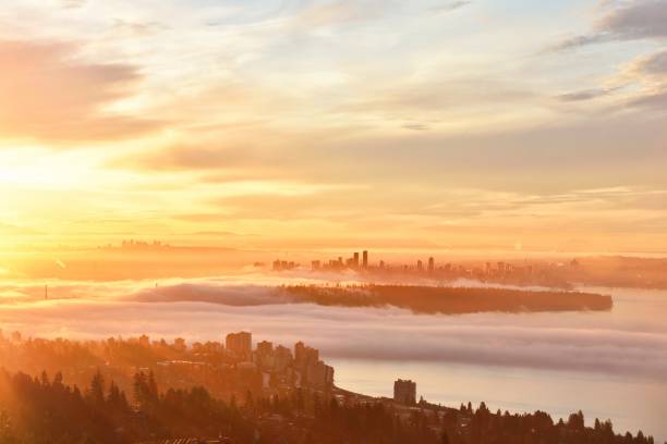 Vancouver Foggy Sunrise, viewed from Cypress Mountain lookout point Vancouver Foggy Sunrise, viewed from Cypress Mountain lookout point west vancouver stock pictures, royalty-free photos & images