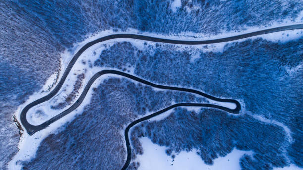 istock winter mountain road view from above 923596622