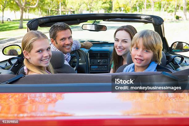 Young Family In Red Convertible Smiling For Camera Stock Photo - Download Image Now - 30-39 Years, 40-49 Years, Adult