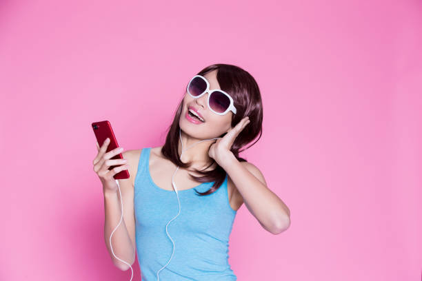 istock woman use phone listen music 923601314