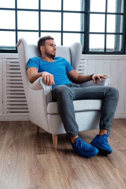 istock Bearded male realaxing in a chair. 923601338
