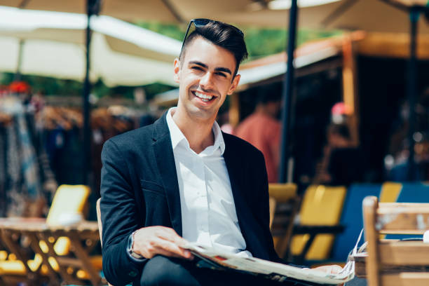 istock Cheerful handsome businessman resting outside cafe 923601970