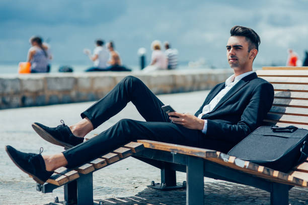 istock Pensive handsome manager relaxing on lounge chair 923602000