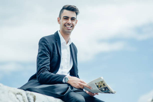 istock Laughing handsome guy looking at camera outdoors 923602014