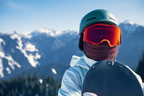 istock one snowboarder with snowboard on winter mountain top 923605192